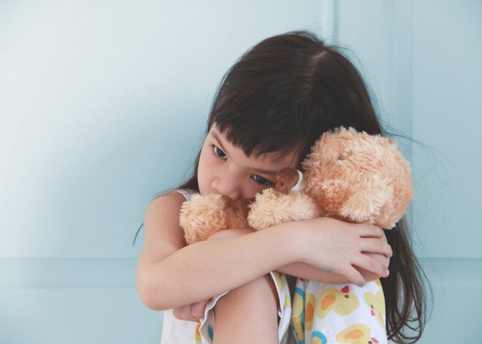 Asian,Girl,Hug,Her,Doll,And,Cry,Or,Scare,Or